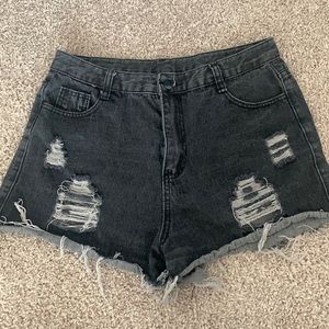 Black high waisted denim cut off shorts. Gently worn. Never dried.